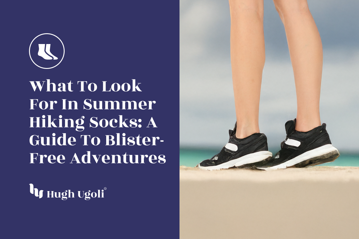 Close-up of legs wearing black sneakers and thin ankle socks on a sandy trail, symbolizing summer hiking comfort and blister protection.